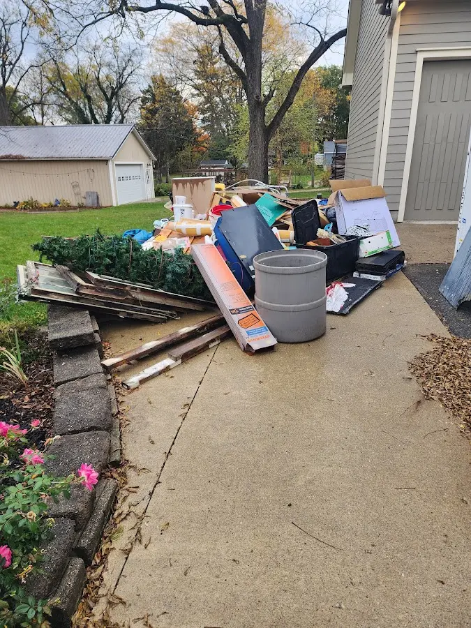 Dumpster being loaded with debris for 3 Yard Dumpster Rental in Wilkinsburg
